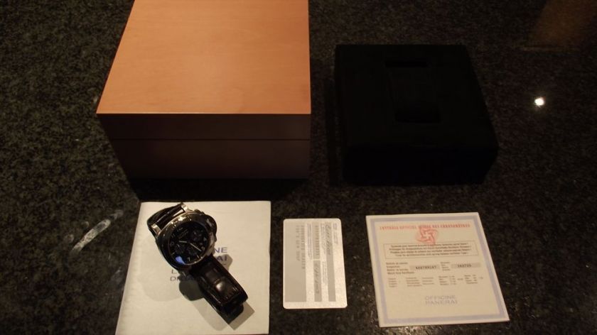 Comes with Pearwood box, booklet and warranty card dated November 2003 